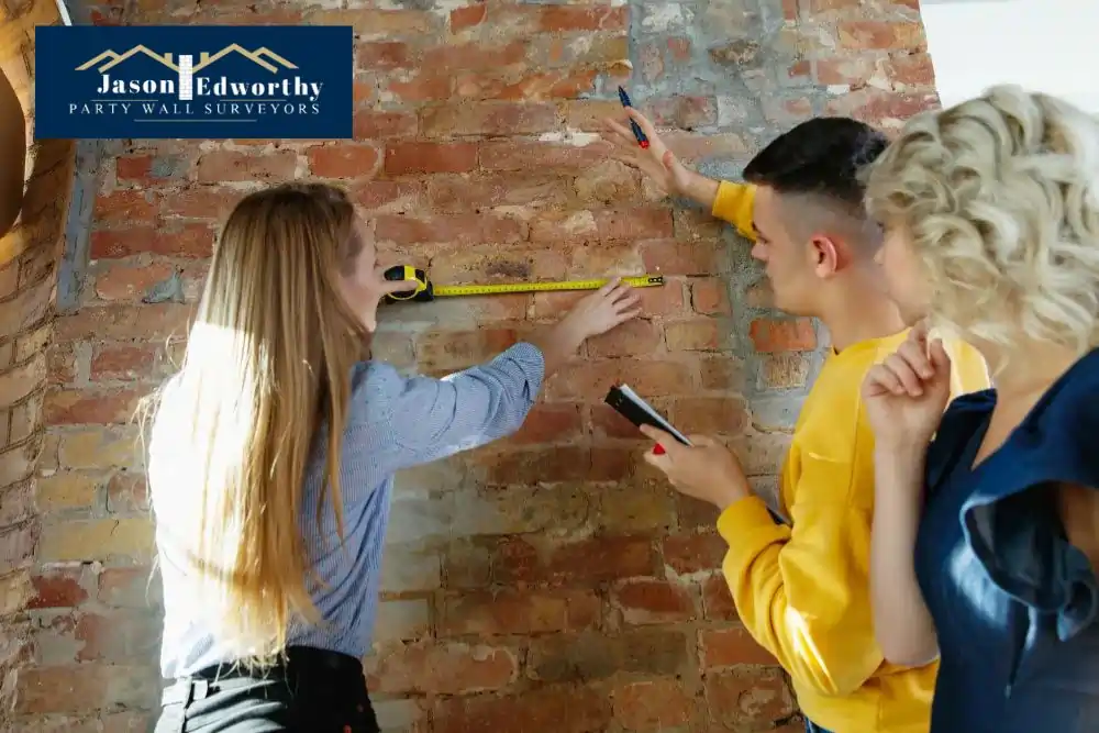 What are the responsibilities of a party wall surveyor Sandy?